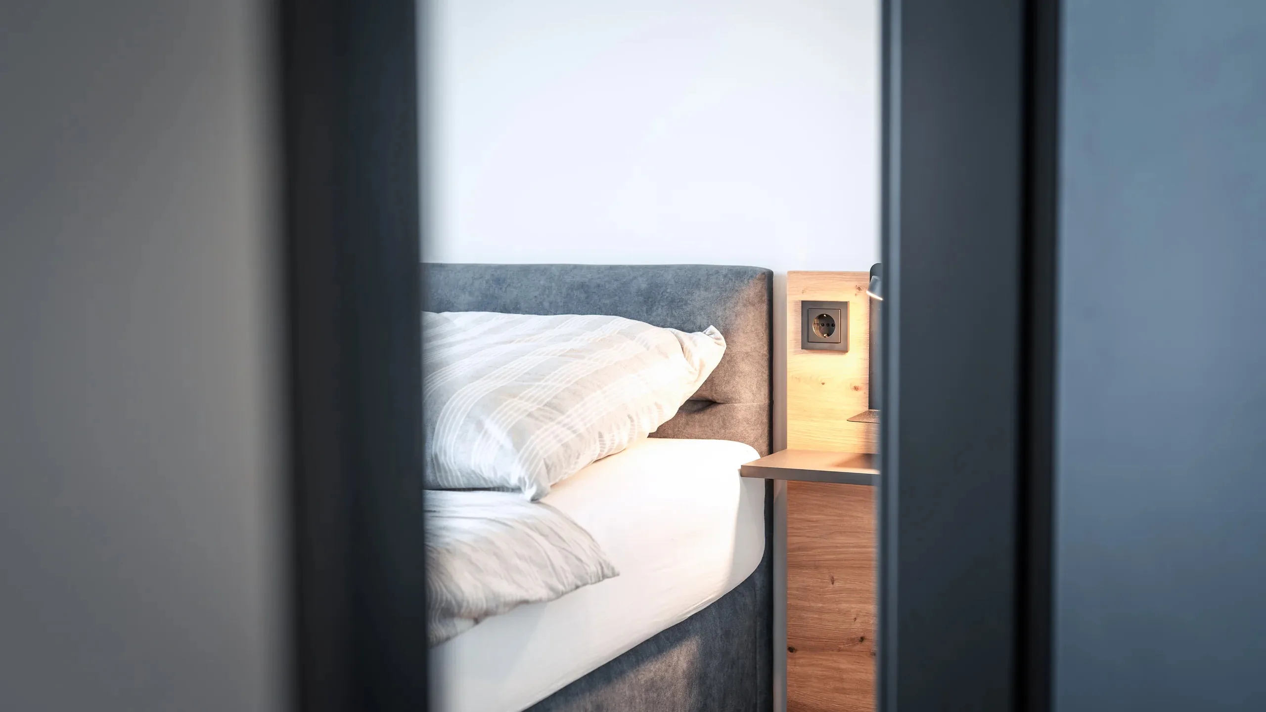Bett-Detail im Apartment der Eighty-Eight Apartments Nürnberg